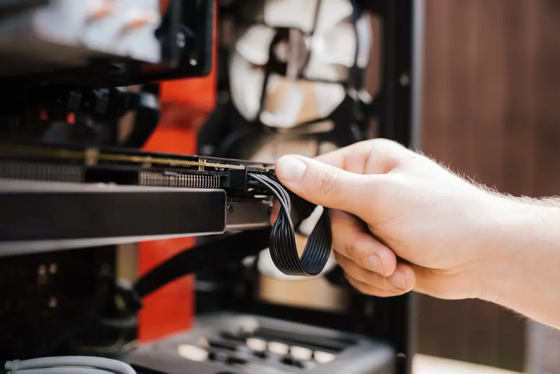 IT field engineer working on a computer setup