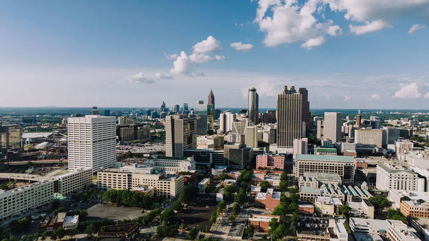 Aerial view of the Atlanta skyline under a blue sky